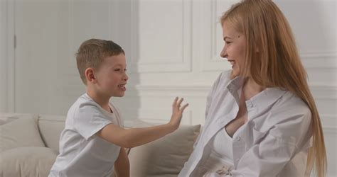 Son plays with mom